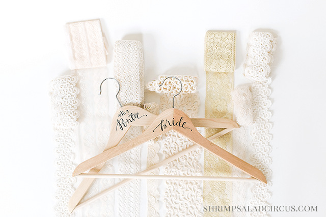 http://www.shrimpsaladcircus.com/wp-content/uploads/2015/02/Calligraphy-Wedding-Hanger-Bride-Bridesmaid-shop.png