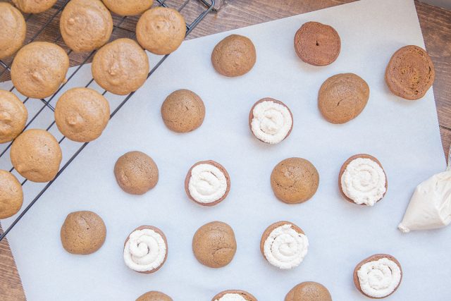 Pumpkin Whoopie Pie Recipe With Maple Spice Whipped Cream - Pipe Filling Onto Cookies