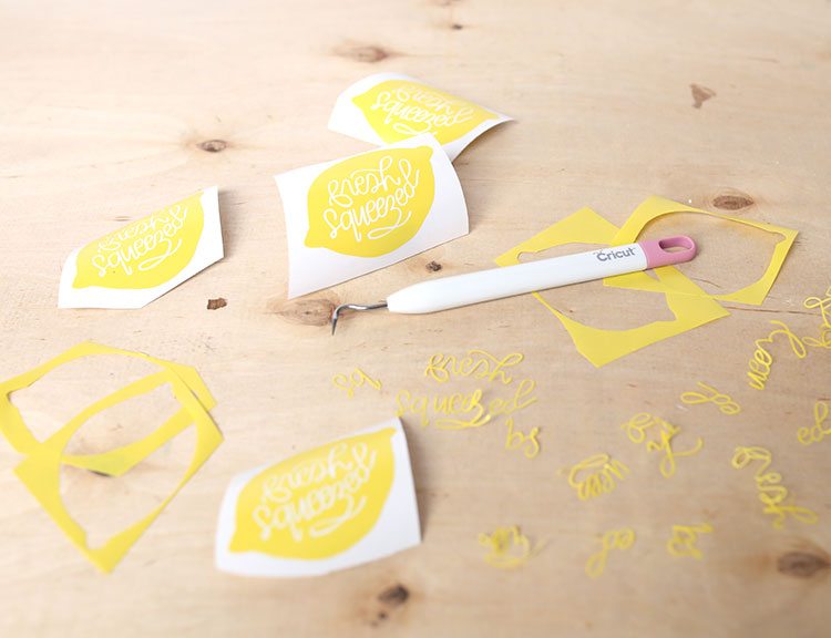 Vinyl lemon decals for Cricut machine on a wooden background