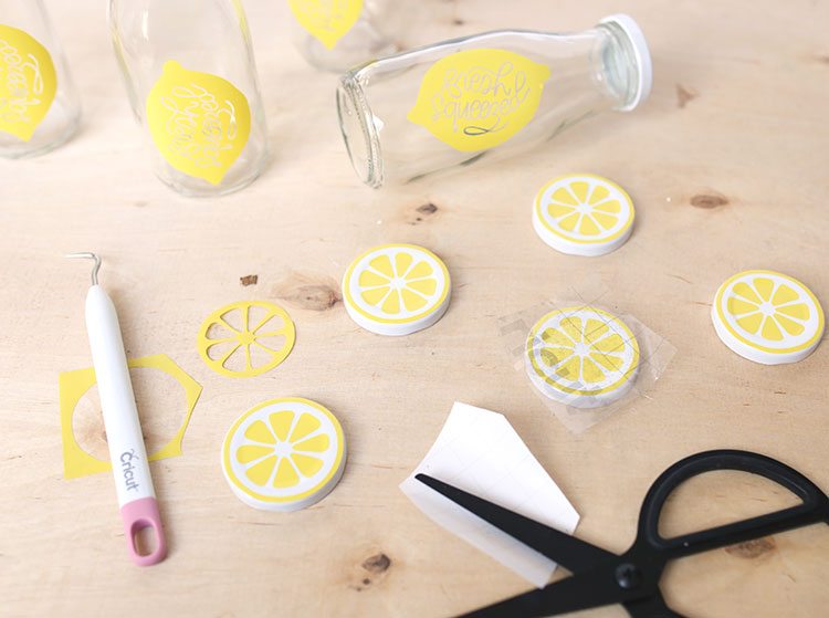 Bottle lids and glass milk bottles with handmade DIY vinyl lemon decals