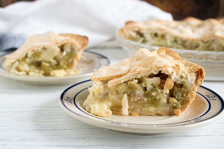 Photo of two plates and a pie dish with Double Crust Rhubarb Custard Pie Recipe