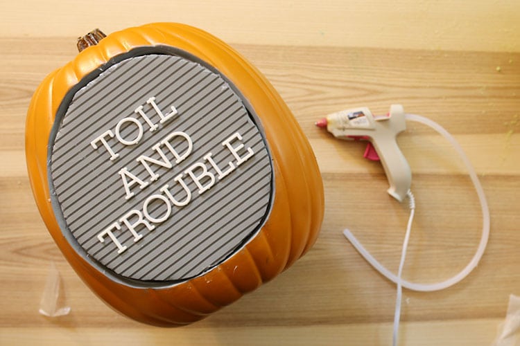 Adding letterboard insert to diorama fake pumpkin for DIY letter board pumpkin for Halloween