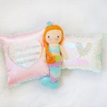 Pink heart magic sequin pillow and iridescent mermaid sequin pillow with Cuddle and Kind Isla mermaid doll