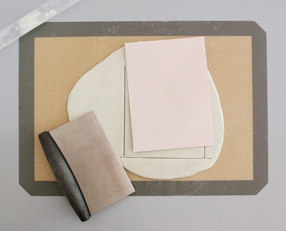 Air dry clay on a silicone baking mat to make a diy baby clay handprint keepsake frame