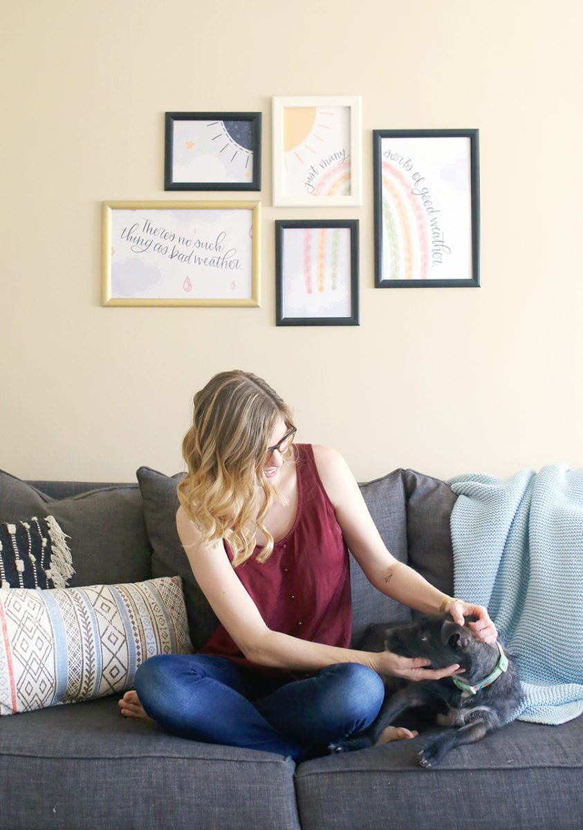 Woman with blonde ombre balayage hair in front of SnapeZo frame gallery wall on a beige background with free printable wall art