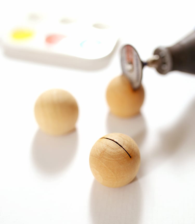 Dremel tool cutting wood balls for DIY place card holders
