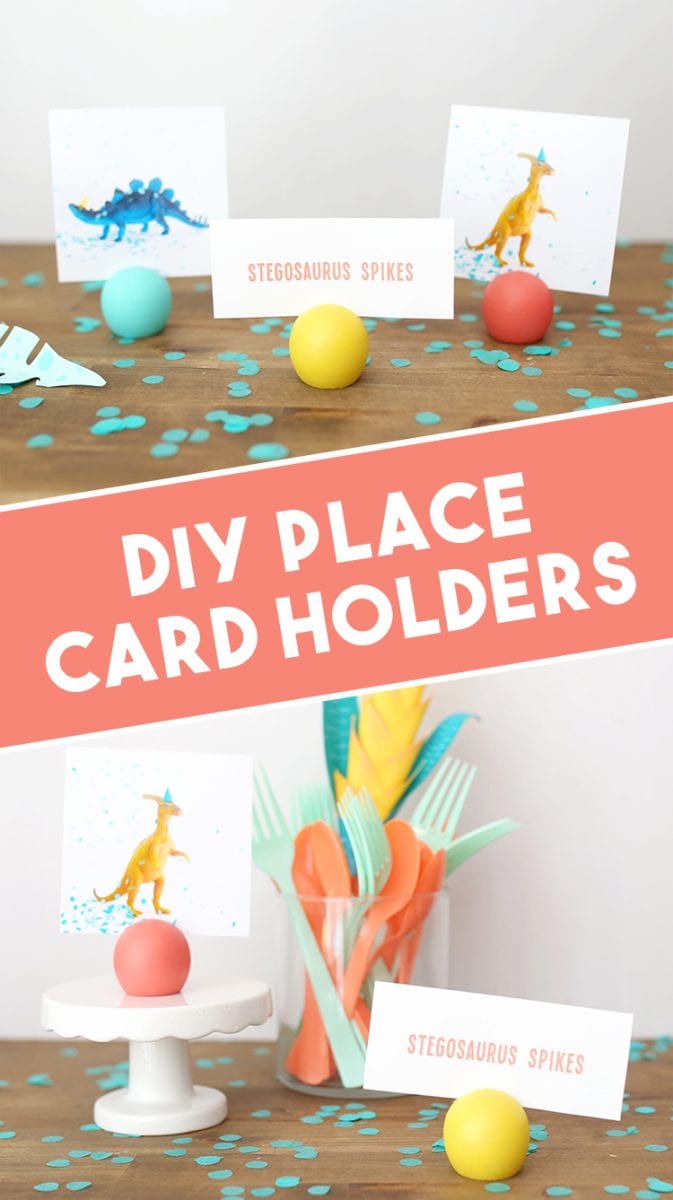DIY place card holder at a dinosaur birthday party setup with yellow, coral, and teal accessories