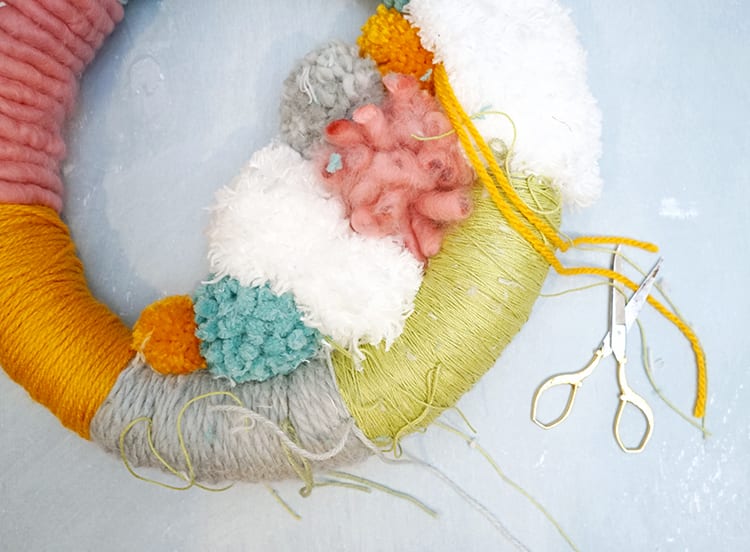 How to Make a Wreath Step by Step - Cut off the Pom Pom Tails