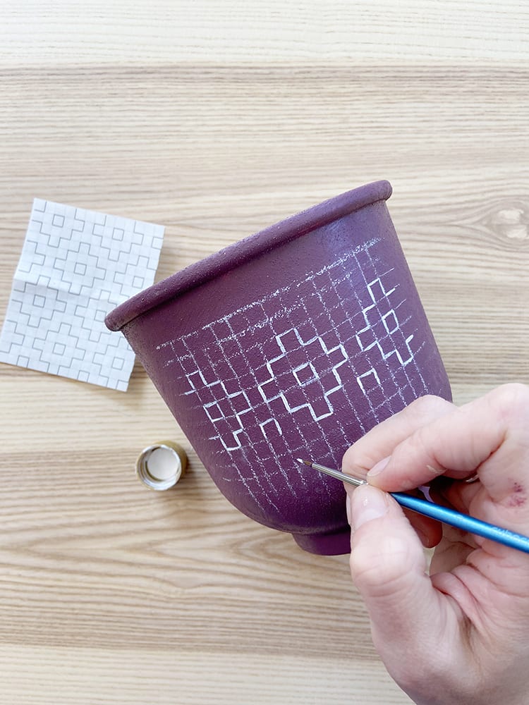 Looking for modern DIY painted terra cotta pots ideas? This boho painted pot idea with acrylic paint uses fun, simple geometric design inspired by sashiko embroidery patterns.