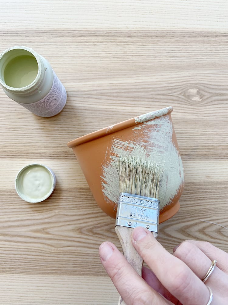 Looking for modern DIY painted terra cotta pots ideas? This boho painted pot idea with acrylic paint uses fun, simple geometric design inspired by sashiko embroidery patterns.