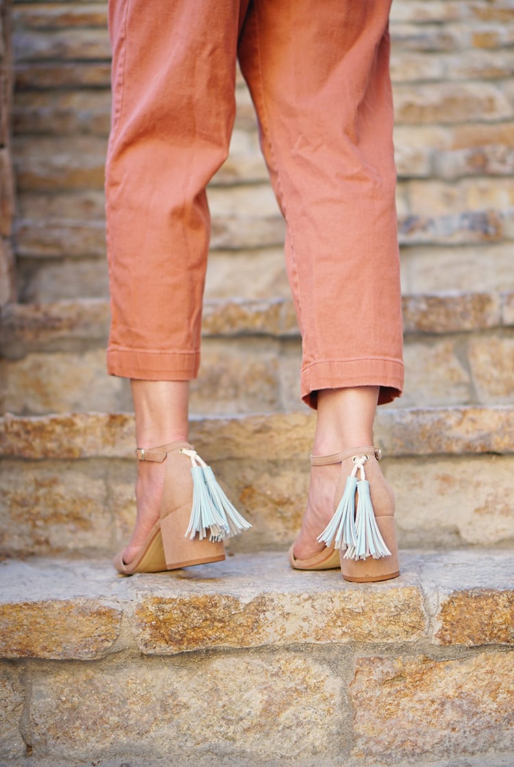 Tutorial: Learn how to make DIY leather tassel shoes, purse, or keyring. These faux leather tassels are perfect for jewelry ideas or to make a vegan leather necklace charm or home decor accessory out of marine vinyl fabric. No sewing required, since you glue instead of sew! They're easy enough to make with kids if you're looking for crafts to make together!