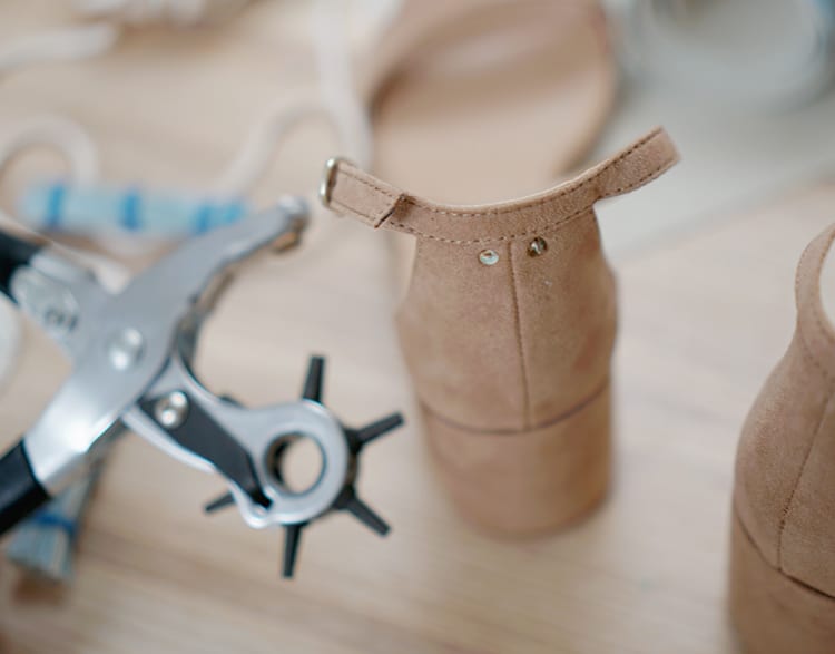 Tutorial: Learn how to make DIY leather tassel shoes, purse, or keyring. These faux leather tassels are perfect for jewelry ideas or to make a vegan leather necklace charm or home decor accessory out of marine vinyl fabric. No sewing required, since you glue instead of sew! They're easy enough to make with kids if you're looking for crafts to make together!